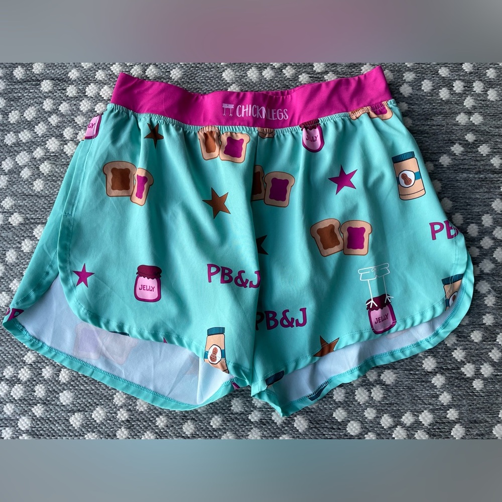 CHICKNLEGS running shorts PB & J 
Men’s 4” inseam Medium peanut butter jelly